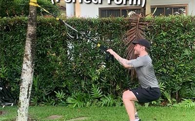 Performing a set of TRX Hamstring Squats with perfect muscle-centric form…